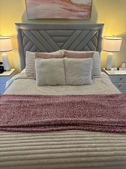 Pink and white and grey pillows for bed