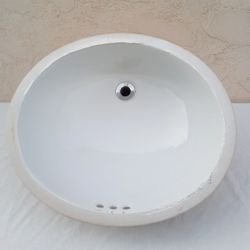 White Undermount Oval Bathroom Sink (19”x 16”) with Overflow - Clean and in Good Shape - Just Needs to Clean Off Some Caulking, 2 Sinks are Available
