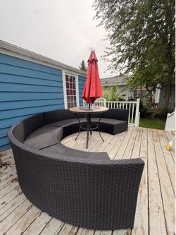 Outdoor seating, table, and umbrella