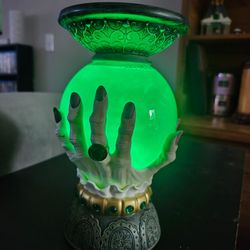 Witch's fortune telling crystal ball candle holder.