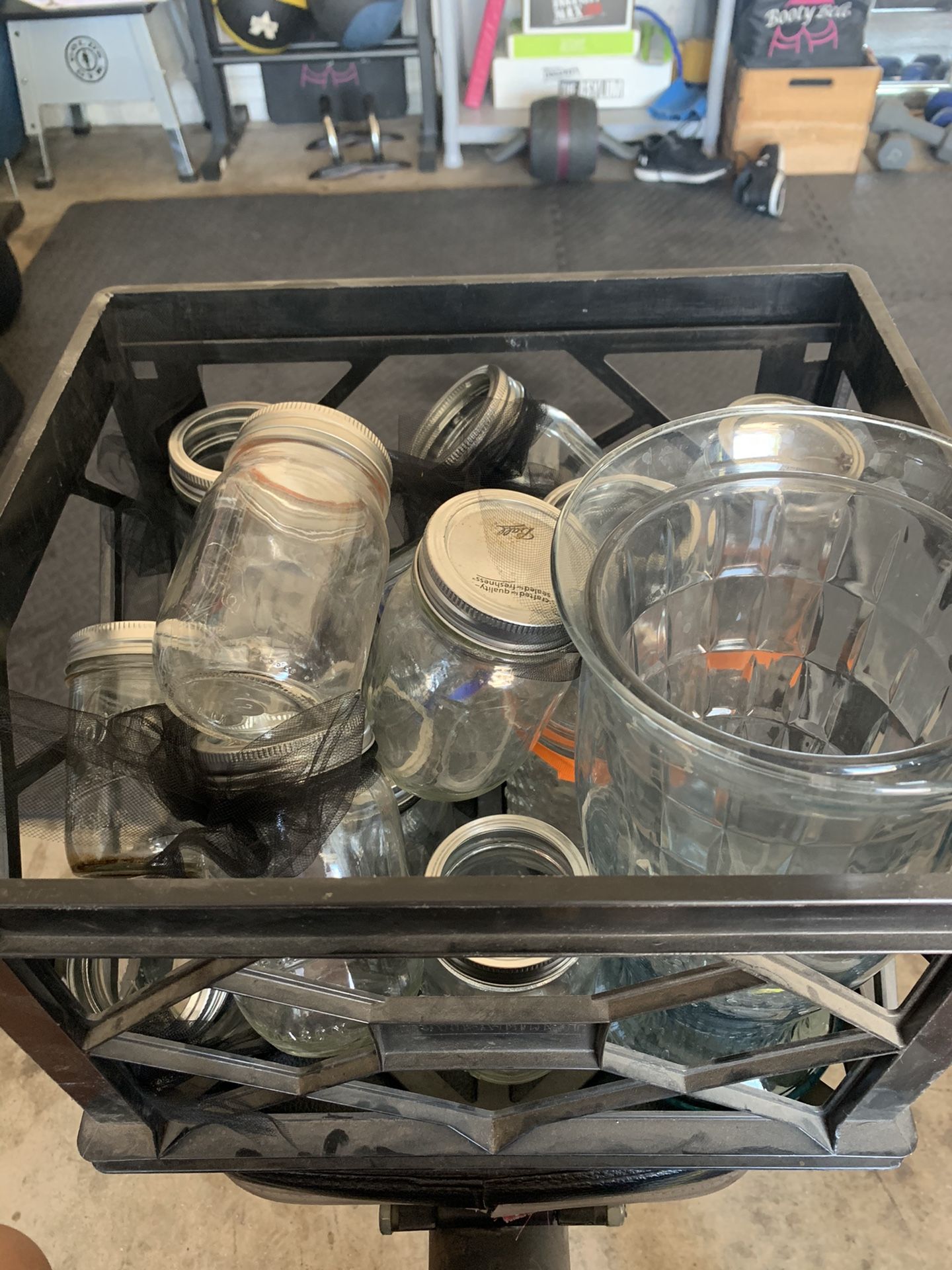Crate of multiple mason jars and other glassware