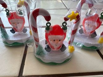 Set of 3 solar swinging Santas