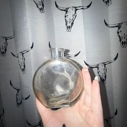 Clear Glass Bottle Rounded Flattened Shape