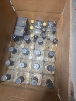 A box full of empty whiskey bottles for arts and crafts