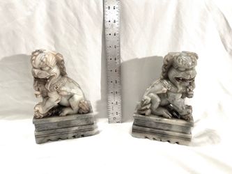 Vintage Chinese (soapstone) carved gray foo lions . 7 inches tall. Valued $105 for the pair.