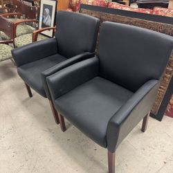 Pair Of Boss Office Box Arm Guest Chairs with a mahogany finish