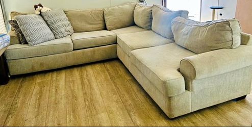 Grey/tan/beige couch. Sits about 6 persons.