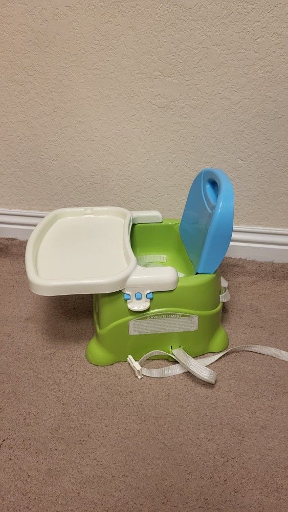 Fisher-Price Portable Toddler Booster Seat for Dining Table.