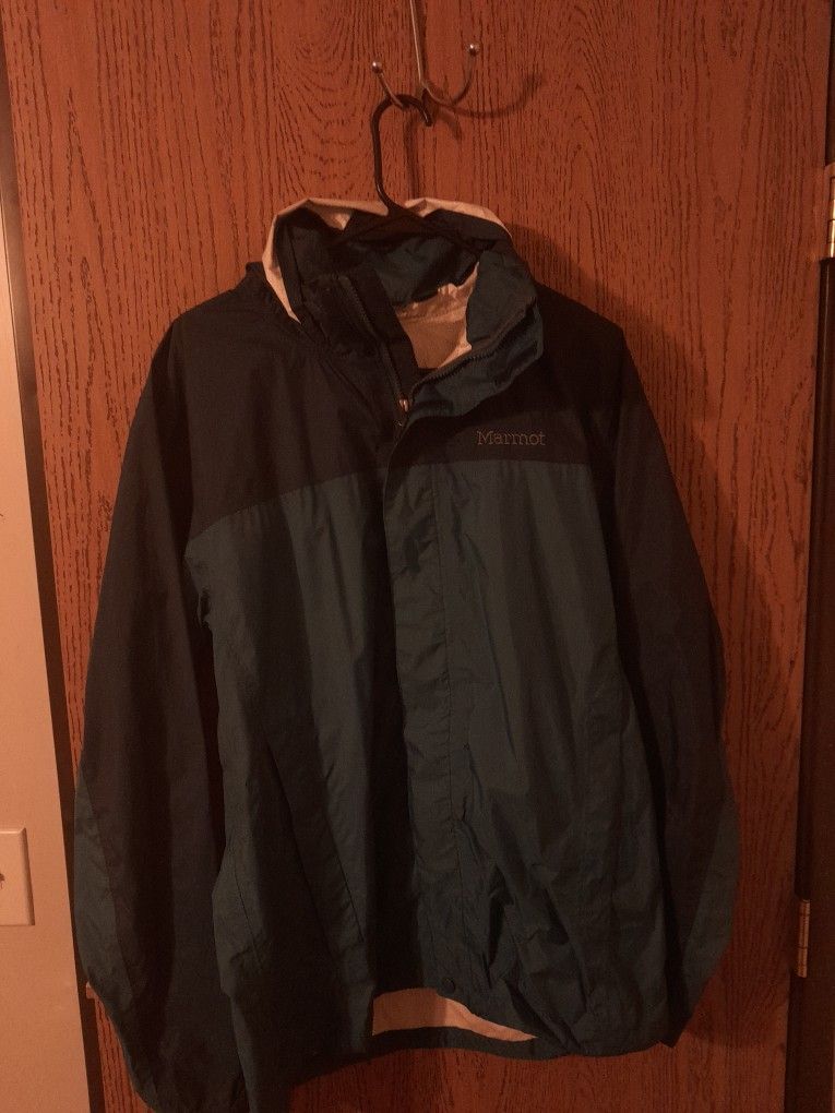 MARMOT rain Hooded Rain Jacket. Large Different Blues In Color. Zip Up, Pockets In An Out.