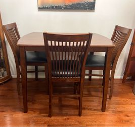 Ashley furniture four piece pub table set