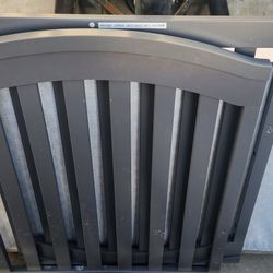 Gray baby crib 