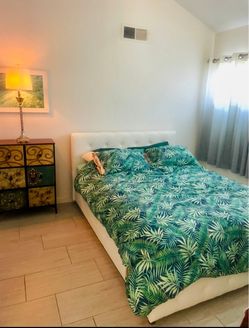 Like New! Queen size faux white leather bed frame and queen size 11 inch firm hybrid mattress
