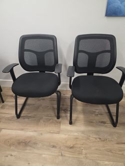 4 black office chairs