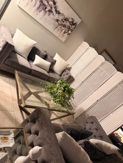Gray Tufted Velvet Sofa and brush gold center table