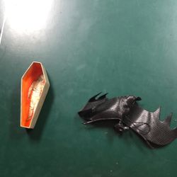 Rubber Bat And Cardboard Coffin