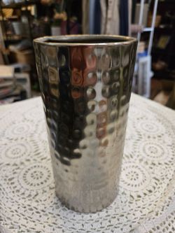 Heavy weighted hammered metal vase