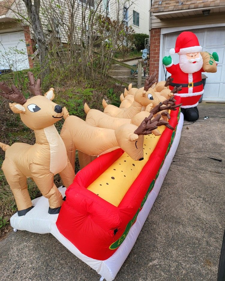 Airblown Inflatables Animated Santa Feeding Reindeer 16.5 ft. Wide