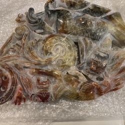 Jade carved statue with a nautical theme