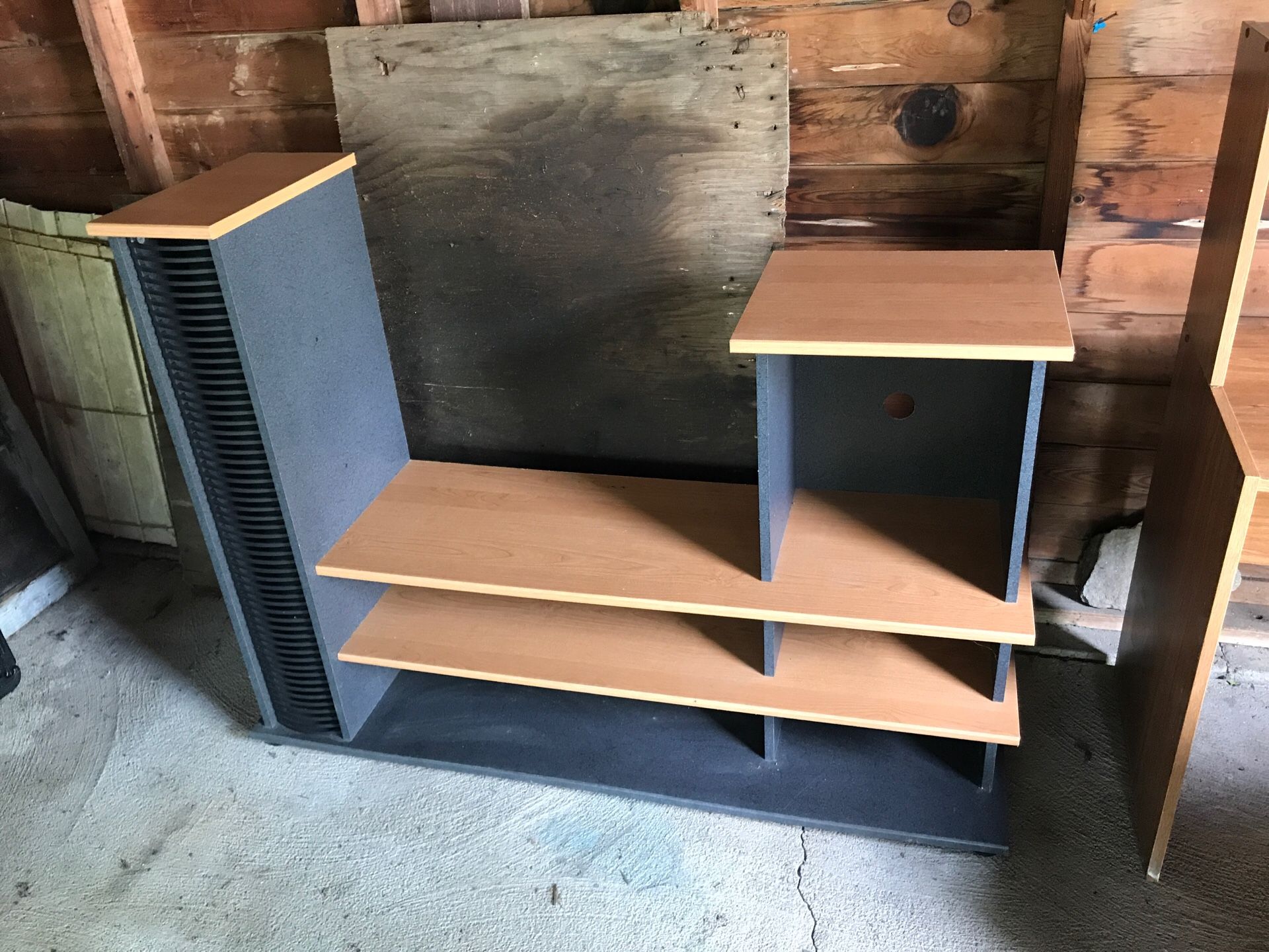 TV/Stereo entertainment center with CD/DVD storage slots on left front.