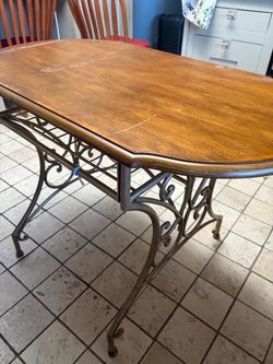 Small dining table with 2 chairs.