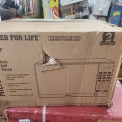 Oster 1.3 Cu. ft. Stainless Steel with Mirror Finish Microwave Oven with Grill

