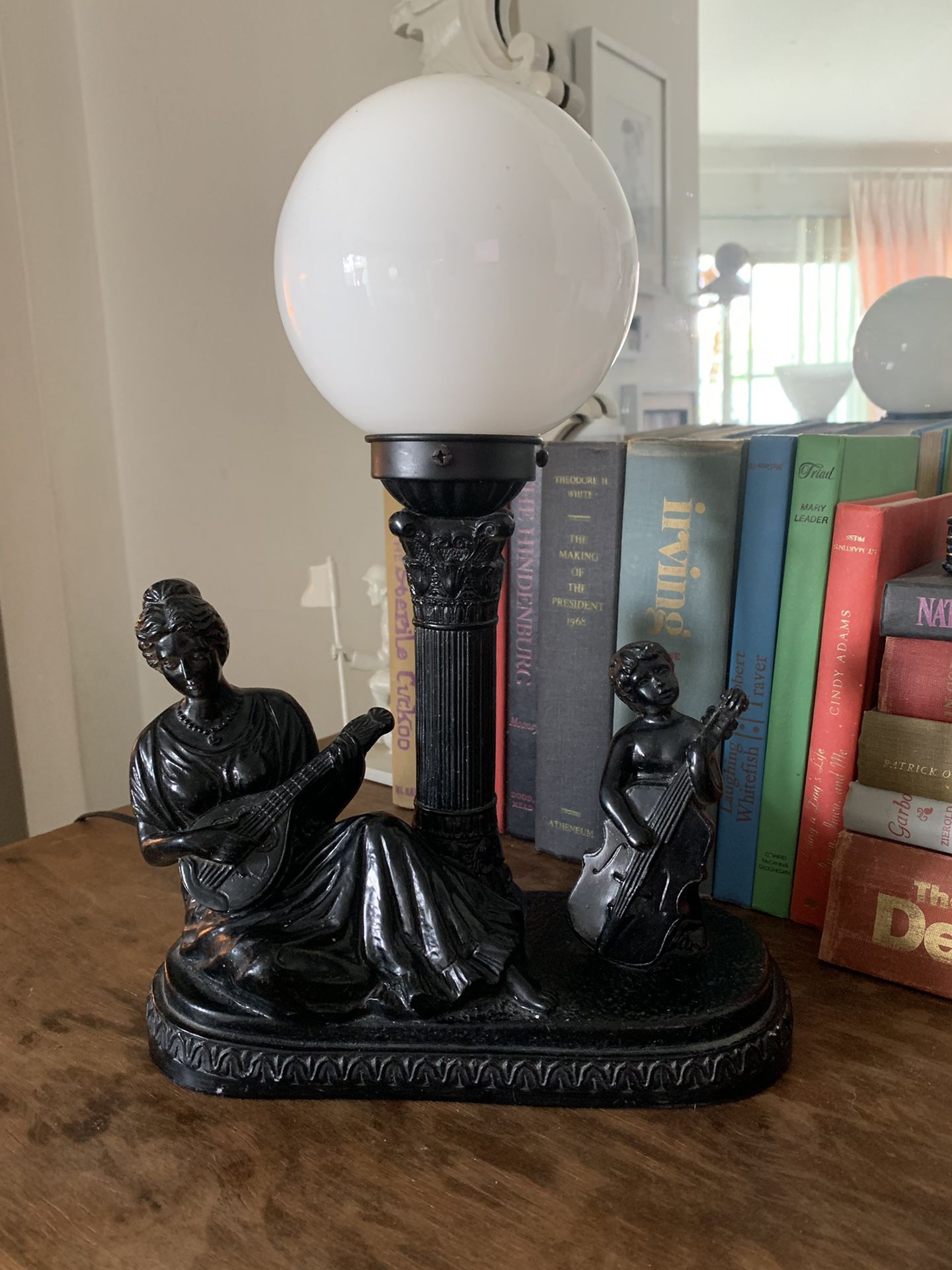 Lady and small girl playing instruments lamp