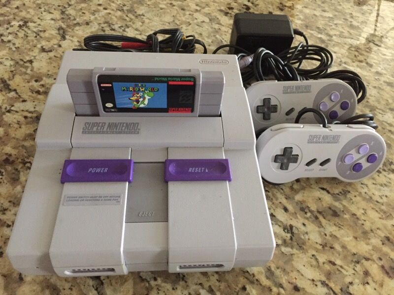 Nintendo SNES w/ Super Mario World Controllers