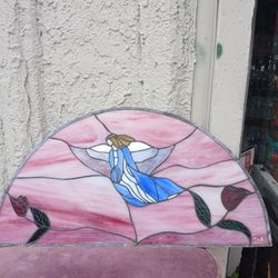 vintage,  stained glass suncatcher featuring an angel with roses