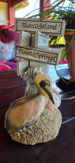 Decorative pelican figurine, reminiscent of the "Life's A Beach" collection