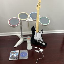 Nintendo Wii Rock band 1 and 2 ( wired drums, guitar, dongel, sticks, pedal and 2 games) TESTED