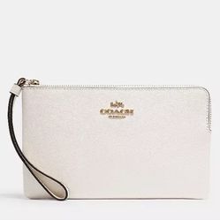 Brand New Coach Large Corner Zip Wristlet Brand New Coach Large Corner Zip Wristlet  Color: Chalk/Gold Retail:$118.00 Pick up only 77090