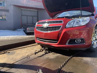 Chevy Malibu- 4 Cyl- 104,000 miles - hit on the right rear - runs and drives - clean title for parts
