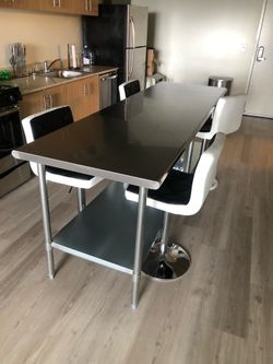 8 FOOT STAINLESS STEEL TABLE