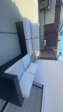 Outdoor Wicker Sofa with White Cushions