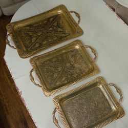 Vintage 3 piece brass color tray set