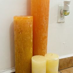 Velas grandes la mayor mide 60cm por 10 cm
