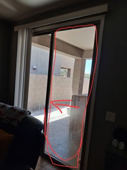 Sliding door panel wit large dog door .