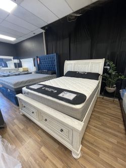 A. White Queen Sleigh Storage Footboard Bed