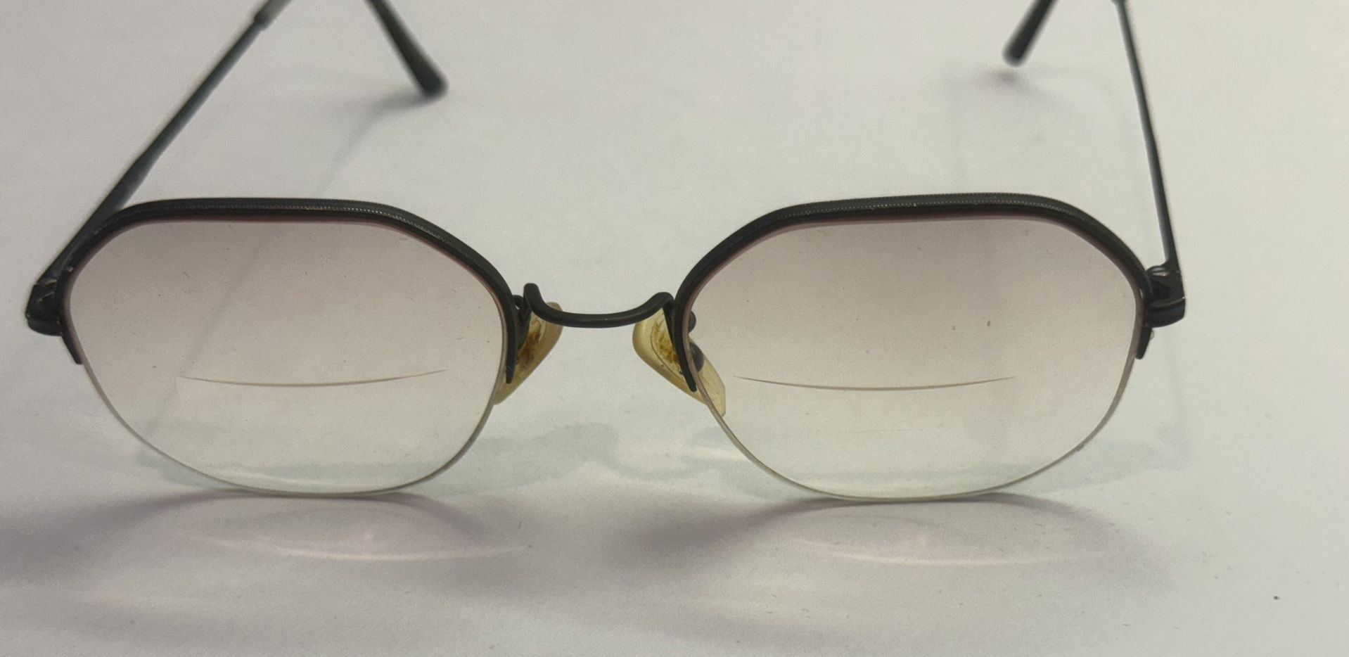 Vintage Reading Glasses Brown Rims Bottom of Lenses are Magnified Top is not.