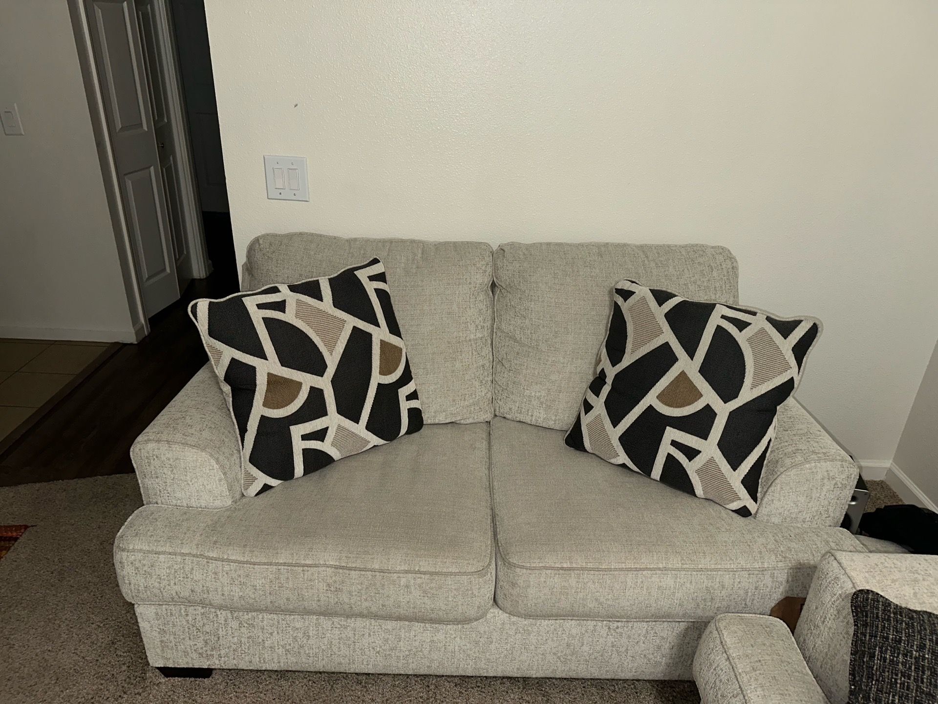 Ashley sofa and loveseat with decorative pillows