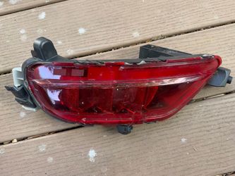 Genuine OEM Mazda CX-5 left rear bumper reflector/fog light.