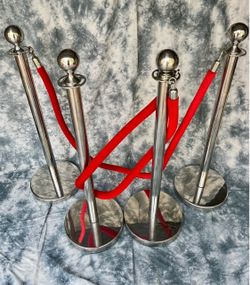 Silver stanchions post with red velvet rope