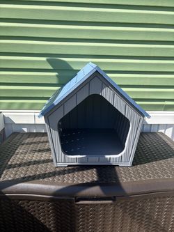 Durable plastic dog house (inside or outside)