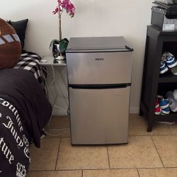 A Mini Fridge With A Freezer