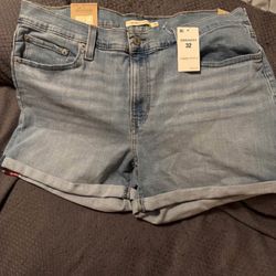 Women’s Levi mid length light blue jean shorts size 32 Brand new with tags