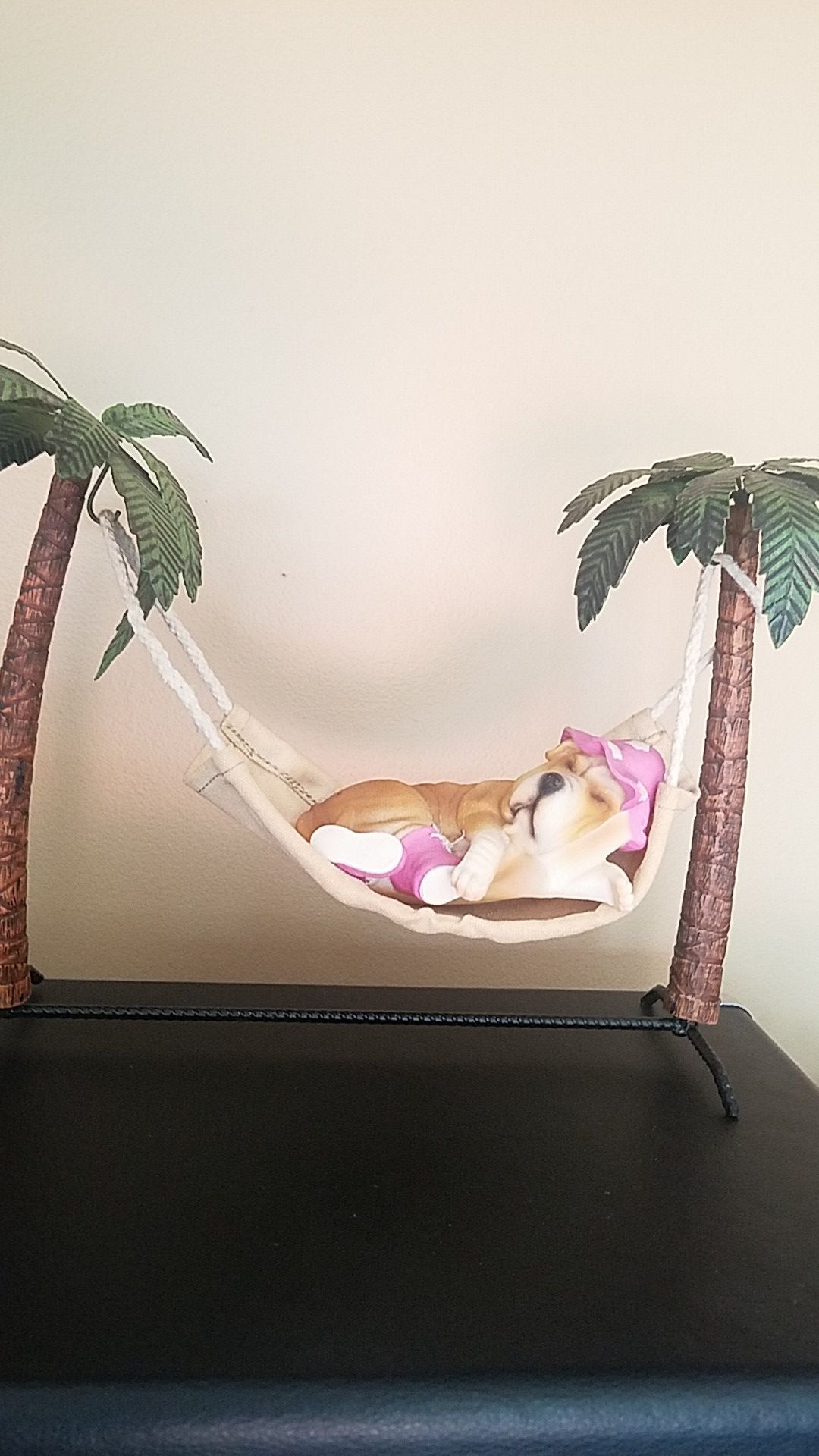 Dog statue on vacation - Sleeping on Hammock
