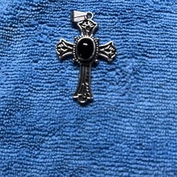 Stainless steel cross with flat on stone