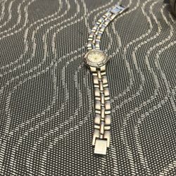 Gold Peck and Peck ladies quartz watch. Needs Battery. 