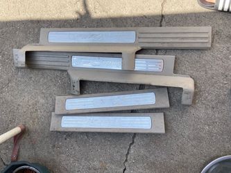Cadillac Escalade 03-06  oem door sill scuff plate set