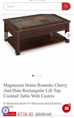 Slate inlay coffee table with metal framing and heavy castor wheels